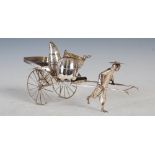A late 19th century Chinese silver table cruet in the form of rickshaw and porter, with three