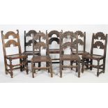 A group of seven late 17th century and later joined oak chairs, all with two domed back bars,