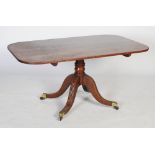 A 19th century mahogany tilt-top table, the top of rectangular form with rounded corners on a single