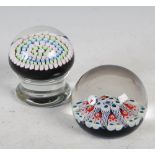 Two Scottish paperweights, comprising; a blue ground millefiori and latticino weight, 8cm
