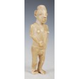 An African tribal ivory figure of a standing female, 19cm high.