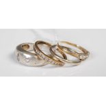 Four assorted rings to include two 9ct gold dress rings, a 9ct white gold wedding ring and another