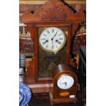 An early 20th century mahogany inlaid mantle clock, incorporating a late 19th century French