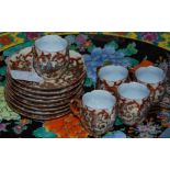 Early 20th century Japanese eggshell porcelain coffee set, elaborately painted in scrolling design