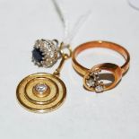 An 18ct gold and diamond set pendant, an 18ct white gold diamond and sapphire ear stud, and a yellow