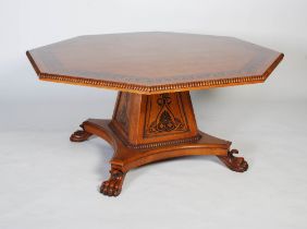 A large oak and ebony inlaid octagonal hall / dining table in the manner of George Bullock, the