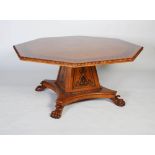 A large oak and ebony inlaid octagonal hall / dining table in the manner of George Bullock, the