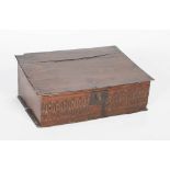 A late 17th century English oak bible box, the hinged lid opening to reveal a large interior, the