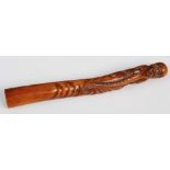 A Japanese wood sashi netsuke/ opium pipe holder of an octopus, 19th century, 21cm long.