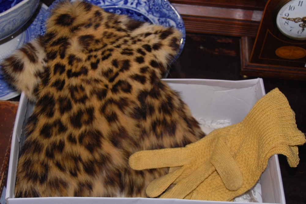 Pair of early 20th century unusual tan leather and ocelot fur gloves, the ocelot fur covering the