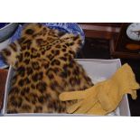 Pair of early 20th century unusual tan leather and ocelot fur gloves, the ocelot fur covering the