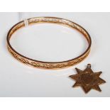A 9ct gold star-shaped pendant, together with a yellow metal bangle with open scroll work sides