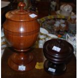 Two turned hardwood vessels, modern in the 17th century style, formed of a squat lidded body on a