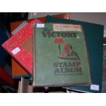 Three vintage stamp albums, to include 'The Victory Stamp Album' in green, another Victory stamp