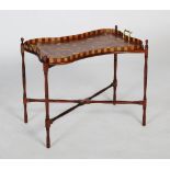 An early 20th century mahogany and marquetry inlaid serving tray on stand, the serving tray of
