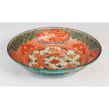Japanese Kutani dish, decorated with central roundel enclosing a dragon within a panelled border