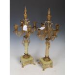 Pair of early 20th century French gilt metal and onyx candelabra, with one central stem and four