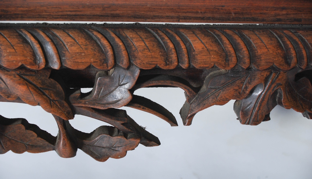 A Chinese carved darkwood bench, Qing Dynasty, the back richly carved in relief with two dragons - Image 6 of 8