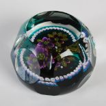 A William Manson hexagonal shaped paperweight, centred with two violets on a green ground within a