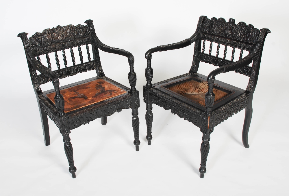 A pair of matched Anglo-Indian ebony armchairs, mid 19th century, possibly Ceylonese, the frames - Image 8 of 10