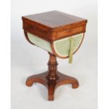 A 19th century mahogany drop leaf sewing / work table, the square top formed of two well figured