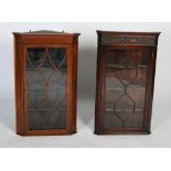 Two 20th century glazed corner cabinets, one with Chippendale style carved frieze to the top, both