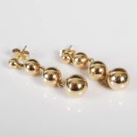 A pair of yellow metal drop earrings, formed as a single row of four graduated balls, 3.2cm, gross