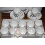 Royal Worcester set of twelve coffee cans and saucers, in 'en grisaille' transfer printed design