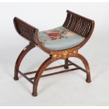 An early 20th century mahogany piano stool, of X-frame shape, the arms with slatted sides, the
