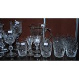Group of cut crystal drinking glasses, to include six tumblers, a water jug and a selection of other