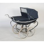A Vintage Silver Cross Pram, with navy enamelled body and white ceramic handle, navy canvas