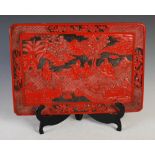 Chinese cinnabar lacquer rectangular tray, late 19th/ early 20th century, carved with figures in a