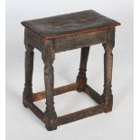 A late 17th century oak joynt stool, with plank top and plain reeded frieze over simple slender