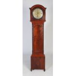 A late 18th century mahogany longcase clock, the arched hood flanked by quarter columns, the trunk