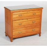 A 20th century beech and pine chest of drawers, with three graduated long drawers with brass swing