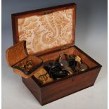 19th century mahogany sarcophagus shaped work box, containing a large collection of assorted