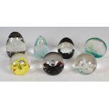 A collection of seven assorted Caithness glass paperweights, comprising; an upright 'Cascade' weight