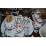 Group of Herend porcelain in red floral pattern, including a pair of twin handled lidded vases, a
