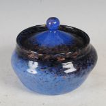 A Monart bowl and cover, shape OB, mottled blue with gold coloured inclusions, 13cm diameter at