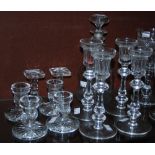 Two sets of late 19th century cut crystal candlesticks, including a set of four candlesticks with
