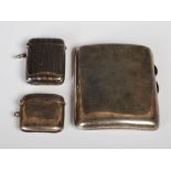 Chester silver cigarette case, Birmingham silver vesta holder, and a silver plated vesta holder (