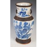 Chinese blue and white porcelain crackle glazed vase, Qing Dynasty, decorated with pavilions in a