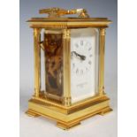 Comitti of London, a brass cased carriage clock.