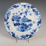 A late 18th / early 19th century Dutch Delft plate, decorated in blue with a Chinoiserie style,