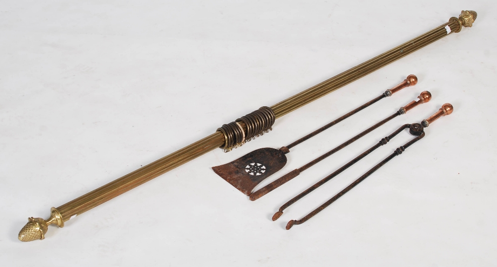 Late 19th/ early 20th century copper handled set of fire irons, together with a brass fluted curtain