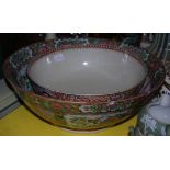 A 19th century French Samson famille rose style punch bowl, the body with chinoiserie design and