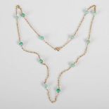 A 20th century 9ct gold and jade necklace, the fine chain set with twelve evenly spaced jade