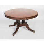 A 19th century rosewood tilt top breakfast table in the manner of William Trotter , the round tilt