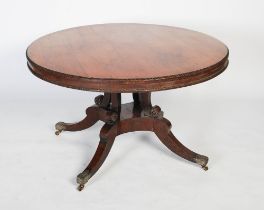A 19th century rosewood tilt top breakfast table in the manner of William Trotter , the round tilt