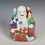 A Chinese porcelain figure of a laughing Buddha, early 20th century, modelled surrounded by five